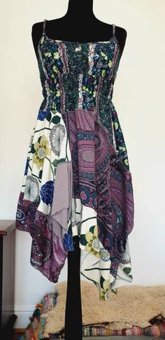 One of a kind very pretty boho floral dress in tones of purple, greens and blues. Made entirely using upcycled fabrics :) this dress fits a uk size 8-12. Bohemian Maxi Dress With Floral Patchwork, Green Floral Print Boho Hippie Dress, Green Floral Print Hippie Dress, Bohemian Purple Patchwork Dress, Bohemian Purple Dress With Patchwork, Bohemian Blue Patchwork Maxi Dress, Purple Bohemian Dress With Floral Print, Bohemian Purple Floral Print Maxi Dress, Blue Patchwork Hippie Dress