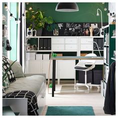 a living room filled with furniture and green walls