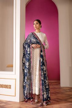 Heavily Embellished Floral White Pakistani Salwar Kameez Party Wear comes in a blissfully ethereal design Sepal features white canvas layered with Applique work Centre panel in Parsigara embroidery. Embroidered Kameez: This elegant Pakistani salwar Suit Paired with paneled Kameez is adorned in mono tone resham, silver and white sequin. Paired with deep colored embroidered organza border. Aesthetically rich pattern is rendered in resham and French knots. Embroidered Trousers: Pakistani Salwar Sui Designer White Sharara With Dupatta, Semi-stitched Off White Salwar Kameez For Reception, Off White Salwar Kameez With Sheer Dupatta For Diwali, Festive White Anarkali Set For Reception, Off White Kurta With Dupatta For Eid, White Traditional Wear With Sheer Dupatta, White Kurta With Sheer Dupatta In Traditional Drape, White Straight Kurta Dress For Reception, White Kurta With Sheer Dupatta