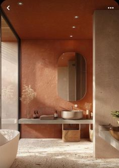 a bathroom with an orange wall and sink