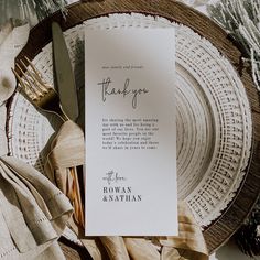 a place setting with a thank you card and silverware on the plate next to it