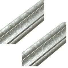 two silver metal bars with intricate designs on them