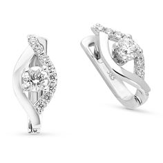 Celebrate your changing, growing and evolving romance with these exceptional diamond flame huggie. Expertly crafted in 18K white gold, each earring features a unique cascading drop outlined with polished and shimmering diamonds. Anchoring each earring, a single round diamond glistens in a unique setting that moves with every beat of her heart and every turn of her head. 
0.52 carat center round cut diamonds
0.26 carat diamond pave setting
18k white gold
The earring design can be c Huggie Earrings With Halo Design In Cubic Zirconia, Diamond White Sterling Silver Huggie Earrings With Halo Design, Elegant White Gold Diamond Earrings With Tension Setting, Elegant Huggie Rings With Diamond Accents, Modern White Gold Huggie Earrings With Cubic Zirconia, Formal Huggie Earrings With Halo Design, Formal Halo Huggie Earrings, Modern Huggie Earrings In Diamond White Cubic Zirconia, Diamond White Earrings With Tension Setting For Formal Events