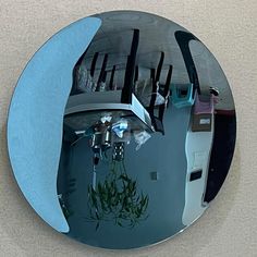 a mirror reflecting the reflection of furniture in it