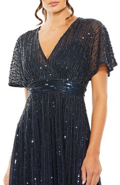 a woman wearing a dress with sequins on it