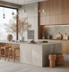 a modern kitchen with marble counter tops and stools in front of a large window