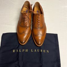 Ralph Lauren Purple Label Sully Lace Up Oxfords Loafers Dress Shoes: 39.5b Made In Italy. Offers Are Welcome. Please Check The Please Check The Measurements In The Photos. Moreover The Manufacturer Measurements Can Be Seen In The Pictures. Ralph Lauren Purple Label Sully Lace Up Oxfords Loafers Dress Shoes Wing Tip: 39.5b Made In Italy Brown Cognac Tapered Toe Leather In Excellent Condition Size 38.5 B, Which Equates To ~7.5 Us Sizing But Please Confirm Measurements I Include In Pictures And Do Fitted Slip-on Oxfords With Brogue Detailing, Fitted Wingtip Loafers With Rubber Sole, Designer Brogue Lace-up Shoes For Workwear, Designer Lace-up Shoes With Brogue Detailing For Work, Wingtip Lace-up Shoes For Semi-formal Spring Events, Fitted Wingtip Loafers For Galas, Calf Leather Wingtip Oxfords For Work, Spring Gala Oxfords With Leather Sole, Wingtip Calf Leather Oxfords For Workwear