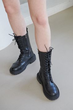 Eda Combat Boots This product has been hand-picked by Storets' stylists. Fall Punk Combat Boots With Round Toe, Punk Style Lace-up Boots With Round Toe For Fall, Punk Style Combat Boots With Round Toe For Fall, High Ankle Combat Boots For Spring Streetwear, High Ankle Combat Boots For Streetwear In Spring, Spring Streetwear High Ankle Combat Boots, Black Knee-high Martin Boots For Spring, Spring Streetwear Moto Boots With Round Toe, Spring Streetwear Ankle Combat Boots