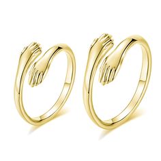 two gold rings on white background with clippings to each other, one in the middle