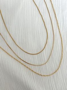 DAINTY FILLED CHAINS – ALV Jewels 14k Gold Filled Chain Link Necklace With Adjustable Chain, Minimalist Multi-strand Necklace With Adjustable Chain, Delicate Charm Necklace With Chain For Everyday, Everyday Delicate Charm Necklace With Delicate Chain, Delicate Chain Necklace For Layering, Minimalist Multi-strand Jewelry With Delicate Chain, Dainty Double Chain Link Necklace, Dainty Everyday Chain Necklace, Multi-strand Gold Chain Necklace For Layering