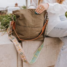 This Versatile Bag Can Work As A Crossbody Or Shoulder Bag. The Bag Comes With A Removable Pu Leather Shoulder Strap And A Canvas Crossbody Strap. Features A Magnetic Closure And 2 Front Pockets To Keep Your Contents Safe! The Interior Features A Black Nylon Lining With A Small Zipper Pocket. Body: 12" X 15" X 4" Pu Leather Shoulder Strap: 27" Canvas Crossbody Strap: 27-48" Width: 2" The Canvas Strap Is More Lightweight Than Our Original Canvas Straps, With Embroidery On One Side. Main Material: Khaki Bucket Bag With Adjustable Strap And Tote Shape, Khaki Crossbody Travel Bag, Khaki Crossbody Bag For Travel, Versatile Green Canvas Bag With Adjustable Strap, Green Hobo Bag With Adjustable Strap For On-the-go, Khaki Double Handle Bag With Adjustable Strap, Khaki Bags With Adjustable Strap And Double Handle, Green Crossbody Canvas Bag For On-the-go, Khaki Satchel Shoulder Bag With Handles