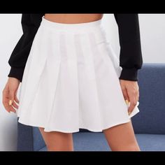 A Skater Skirt With A High-Rise Waist, Zipper On The Side, Pleated Detailing, A Mini Hem, And A Flared Silhouette. Trendy White Mini Skirt For Fall, White Lined Mini Skirt For Fall, Trendy White Skort For Fall, White Skort For Fall, High Waist White Skort For Fall, Casual White Skirt For Fall, Casual White Pleated Skirt For Fall, White Mini Length Skort For Fall, White Tennis Skirt For Fall