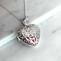 ...This is your perfect gift! Sterling Silver Filigree Heart Locket Pendent with beautiful Heart shaped floating Pink Crystal hidden inside as a surprise ...hanging on a gorgeous 18 inch Italian Curb chain. Name Necklace Description: Sterling Silver 925 SOLID - not Plated like most others are - Style: Locket Stone: Crystal simulated Heart shape Chain Type: Curb Chain in Solid Sterling Silver Length: 18 Inches weight: 7.6g BRAND NEW and the perfect gift for Mothers Day, your wife, girlfriend, loved one or a just a treat for yourself.  USA's company Please don't hesitate to contact us if you have any questions regarding this item. Crystal Locket, Filigree Heart, Gift For Mothers Day, Pendent Necklace, Sterling Silver Filigree, Stone Crystal, Vintage Heart, Heart Locket, Beautiful Heart