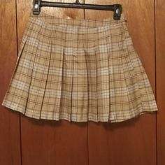 Forever 21 Plaid Skirt. Size L. Color Beige With Cream And Brown Plaid. Button And Zipper Side. Approximately 15" Laying Flat Across Waist. Approximately 16" From Top Of Waist To Bottom Of Hem. (See Photos). Like New, Never Worn. No Rips, Tears Or Wear. (Always And Still From Non-Smoking Household) Forever 21 Lined Skort For Fall, Forever 21 Skort With Lined Skirt For Fall, Trendy Beige Lined Tennis Skirt, Forever 21 Mini Tennis Skirt With Lining, Forever 21 Mini Tennis Skirt Lined, Forever 21 Pleated Mini Skort, Casual Cream Mini Skirt For Fall, Beige Spring Skort For School, Cream Mini Pleated Skirt