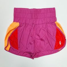 Note: This Colorway Arrived With A Strange Print Mark Around The Logo On The Front Of The Short. They Are Minor, But Price Reflects. Please Note This Before Purchasing. Thanks! Product Details Speed Up Or Slow Down In These Breezy, Warm-Up Style Running Shorts, Featuring A Boldly Smocked Waistband With A High-Rise Silhouette And Split Hem. Pull-On Style Stretch Waistband Relaxed Fit Fp Movement A Destination For The Life Well-Lived, Free People Movement Offers Performance-Ready Activewear, Pract Pink Nylon Shorts For Gym, Pink Color Block Workout Bottoms, Pink Fitted Casual Athletic Shorts, Pink Nylon Beach Bottoms, Pink Nylon Workout Bottoms, Pink Color Block Athleisure Bottoms, Pink Sporty Shorts For Beach, Fitted Pink Athletic Shorts For Beach, Sporty Pink Shorts For The Beach