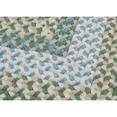 two blue and green rugs on top of each other