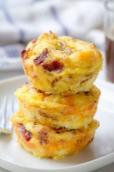 three breakfast muffins stacked on top of each other