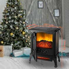 a christmas tree is next to an electric stove