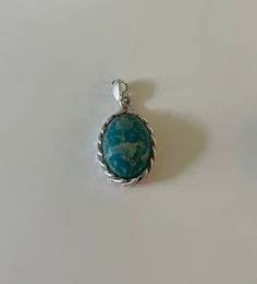 Gorgeous Boho Sterling Silver Turquoise Pendant. Its handmade and one of a kind with unique imperfections. one ever made.  Made of 925 Sterling Silver and Turquoise. (Genuine) Turquoise, the captivating sea-green stone of the ancients, represents wisdom, tranquility, protection, good fortune, and hope. Ancient peoples believed in its profound power to protect, as well as its tranquil energy and its association with enduring love. Likewise, contemporary crystal experts celebrate it for its repres Artisan Blue Oval Turquoise Necklace, Artisan Oval Turquoise Blue Necklace, Handmade Turquoise Chrysocolla Necklace, Turquoise Chrysocolla Gemstone Necklace, Blue Chrysocolla Necklace With Large Stone, Bohemian Oval Turquoise Necklace, Blue Turquoise Chrysocolla Necklace With Large Pendant, Blue Turquoise Necklace With Large Chrysocolla Pendant, Turquoise Necklace With Large Chrysocolla Pendant