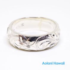 Custom order and Hand made in the Aloha StateHand engraved with Old English design - Hawaiian Maile, Plumeria, and Ocean wave.Made with sterling silver. Ring width is selectable from 4mm to 12mm, Thickness is 2mm.Picture shown above has width of 4mm and 6mm.Ring is perfect for people with an active life style, also great gift for anniversary, wedding or any special occasion. *Free inside message engraving. To make the piece more personal, you can add a special message on the inside of the ring, Classic Sterling Silver Carved Engraved Ring, Classic Carved Sterling Silver Engraved Ring, Sterling Silver Carved Promise Ring, Traditional Jewelry With Engraving Option For Anniversary, Adjustable Carved Sterling Silver Jewelry, Carved White Gold Ring, Carved Sterling Silver Heirloom Jewelry, White Engraved Jewelry For Promise, Heirloom Carved Sterling Silver Engraved Ring