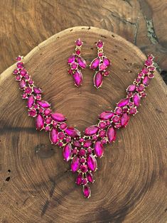 "These fun and stylish pink teardrop cluster crystal rhinestone necklace and earrings set are a great statement piece!  Size of earrings: 1.75\" Long.  Necklace 16\"long with 3\" chain extender Decor Size: 2\" Color: hot pink/fuchsia  Base metal color: gold More colors available upon request, just message us! Need a matching bracelet? https://www.etsy.com/listing/587303889/fuchsia-bracelet-fuchsia-rhinestone?ref=shop_home_active_5 Looking for the perfect pair of earrings for a special occasion. We specialize in custom work in fashion jewelry, pearls, and natural stones! Please feel free to browse through our other listings, and if you can't find what you are looking for just send us a message and will create the perfect piece for you. Jewelry.desertrosedesigns.net Expedited shipping availa Pink Crystal Rhinestone Necklace In Glamorous Style, Glamorous Pink Rhinestone Necklace For Party, Pink Crystal Jewelry Sets With Rhinestones, Pink Crystal Glamorous Necklace, Pink Rhinestone Jewelry Set For Party, Glamorous Pink Rhinestone Necklace, Glamorous Pink Crystal Necklace, Glamorous Pink Necklace For Party, Teardrop Pink Rhinestone Jewelry