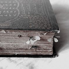 an old book sitting on top of a table