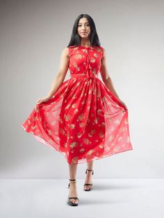 Reflect the versatility and grace of fusion fashion with our Vibrant Verve - Red Printed Chiffon Knee Length Indo Western Dress. This 'Indo western' dress, woven with premium red chiffon, flaunts an enticing print that exudes a vibrant charm. The knee length enhances the modern appeal of the attire, making it an ideal choice for both festive and casual gatherings. This dress is the hallmark of a stylish blend between cultural depth and contemporary elegance. Care instructions: Dry clean only, do Red Flowy Dresses For Casual Occasions, Flowy Red Dresses For Casual Wear, Fitted Red Chiffon Dress, Fitted Red Chiffon Midi Dress, Red Chiffon Midi Dress, Fitted Red Chiffon Maxi Dress, Red Fitted Maxi Chiffon Dress, Red Fitted Chiffon Maxi Dress, Red Flowy Chiffon Dress