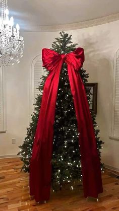 a christmas tree with a red bow on it