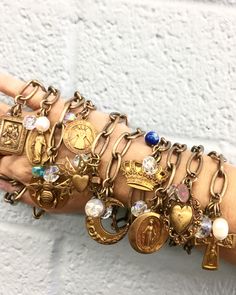 Tarnished Brass Link Charm Bracelets. Choice of charms include Saint Christopher, Madonna, Honey Bee, Guardian Angel, Sacred Cross, Moon,Crown,Mother Mary,Filigree Heart, or Holy Family Cross. In addition to the charm, each bracelet is adorned with a crystal and assorted bead. 7 1/2 " in length. Pick your favorite or buy several to stack on your wrist! Cuff Watch, Bee Necklace, Jewel Box, Queen Bee, Jewelry Inspo, Queen Bees, Heart Bracelet, Jewelry Projects, Charm Bracelets