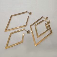 Introducing the Neva Earrings, the perfect addition to your jewelry collection. These stunning earrings feature a unique geometric design that is both modern and timeless. Crafted from high-quality stainless steel and plated with 18K gold, these earrings are durable and long-lasting. The Neva Earrings are lightweight and comfortable to wear, making them a great choice for everyday wear or special occasions. The delicate size of these earrings is perfect for adding a touch of elegance to any outf Modern Stainless Steel Drop Earrings, Modern Everyday Diamond-shaped Jewelry, Modern Diamond-shaped Everyday Jewelry, Modern Geometric Pierced Earrings, Elegant Geometric Everyday Earrings, Modern Geometric Ear Wire Earrings, Modern Geometric Linear Earrings For Gifts, Modern Geometric Nickel-free Earrings, Modern Stainless Steel Earrings For Gift