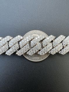 Men's 14mm wide Cuban Link prong set Chain set with moissanite
One of the iciest chains we ever made!!! Fully iced can't even see the metal!
 
Heavy 140-252 grams depending on length!
24" is 201 grams!!! VERY HEAVY CHAIN
 
REAL MOISSANITE
Comes with GRA Certificate
PASSES DIAMOND TESTER!!! ANY PEN OR LIGHT TRANSMISSION DIAMOND TESTER (Will show up as moissanite and not diamond on lab assays however)
32.5-54.6ct (depending on length...for instance 20" is 44.17ct) genuine D Ice Necklace, Cuban Link Necklace, American Diamond Necklaces, Diamond Ice, Miami Cuban Link, Diamond Tester, Cuban Link Chain Necklaces, Heavy Chain, Miami Cuban