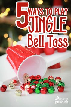 the words 5 ways to play jingle bell tass on a white table with red and green bells