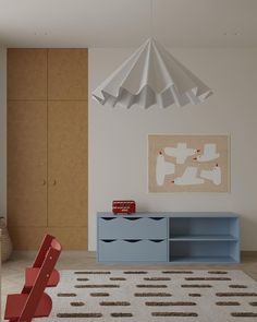 a living room with furniture and an umbrella hanging over it's head on the wall