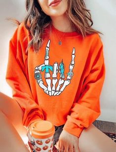 Unisex fit crew neck sweatshirt 50% cotton 50% polyester ••Holiday & seasonal items are FINAL SALE•• Orange Crew Neck Sweater With Ribbed Cuffs, Orange Crew Neck Sweatshirt For Streetwear, Orange Ribbed Cuff Crew Neck Sweater, Graphic Print Orange Sweatshirt For Streetwear, Orange Long Sleeve Sweatshirt For Winter, Orange Ribbed Cuffs Sweatshirt For Fall, Orange Letter Print Crew Neck Hoodie, Relaxed Fit Orange Sweatshirt With Graphic Print, Orange Sweater With Relaxed Fit And Long Sleeves