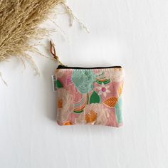 Stash your odds and ends with this adorable square mini zipped pouch! As beautiful as it is functional, these bags are perfect for travel or everyday use! A mini first aid kit, a manicure set, jewelry holder or small makeup bag - it can be used for any organizational purpose!  Buy it for yourself or as a thoughtful gift to a friend or a family member! Makes a great gift paired with a gift card holder.  Specs: Approx 5"x4" Metall ykk zipper  Zipper is accented with a leather pull tag Lined with a Rectangular Pink Pouch For Personal Use, Pink Square Pouch For Daily Use, Pink Rectangular Pouch For Personal Use, Compact Pink Coin Purse For Travel, Pink Rectangular Pouch For Gift, Pink Rectangular Pouch As Gift, Compact Pink Travel Coin Purse, Pink Rectangular Cosmetic Bag Gift, Compact Pink Zipper Pouch Bag