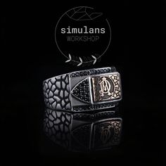 Introducing our exquisite Personalized Sterling Silver Men's Ring, a perfect blend of elegance and craftsmanship. Handcrafted with solid 925 sterling silver, this unique piece features a customizable area on the top where you can have your initials or a special symbol engraved, making it a truly personal accessory. The sides of the ring are adorned with a raised pebble pattern, adding a rugged yet refined texture. The top is embellished with black onyx stones, which provide a striking contrast a Luxury Black Engraved Ring In Sterling Silver, Luxury Black Signet Ring Stamped 925, Mens Signet Rings, Signet Ring Men, Special Symbols, Sterling Silver Mens Rings, Unique Gifts For Him, Signet Rings, Black Onyx Stone