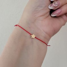 Flower bracelet, gold plated, dainty flower bracelet, charm bracelet, friendship, bff, make a wish, bridesmaids gift, Spring, adjustable Beautiful minimalist gold plated flower and string bracelet.  Mix and match with other bracelets available in our store, for an effortlessly chic look!  Also a perfect gift for your bff, your bridesmaids, or a special person in your life.  8 mm gold plated flower, moves loosely from imitate silk polyester string.  The bracelet is adjustable from 7-8 inches, it closes and opens through sliding knots.  You can adjust the bracelet by simply pulling the opposite threads.  The bracelet comes with adjustable cord in the color of your choice: Black, red, white, green, dark green,  light blue, blue, neon pink, yellow, dark red, dodger blue, indigo, colorful, pink Gold Charm Bracelet With Adjustable Length, Gold Charm Bracelet With Adjustable Length As Gift, Adjustable Gold Plated Charm Bracelet For Gift, Gold Friendship Bracelets With Adjustable Length As Gift, Delicate Yellow Gold Charm Bracelet Gift, Dainty Red Charm Bracelet As A Gift, Handmade Gold Charm Bracelet With Flower Shape, Delicate Adjustable Bracelets As Gift, Delicate Adjustable Bracelets For Gifts