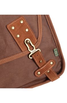 With a stylish design that can be carried by men and women, this flap bag offers plenty of slots to organize all of your essentials when traveling through town. 14"W x 12"H x 5"D; 24" strap drop Textile/leather Imported Brown Shoulder Bag With Anti-theft Pocket, Brown Bags With Anti-theft Pocket For Daily Use, Outdoor Brown Bag With Anti-theft Pocket, Brown Rectangular Shoulder Bag With Anti-theft Pocket, Brown Outdoor Bags With Anti-theft Pocket, Canvas Shoulder Bag With Anti-theft Pocket For Travel, Brown Anti-theft Backpack Shoulder Bag, Brown Outdoor Shoulder Bag With Anti-theft Pocket, Brown Flap Saddle Bag With Adjustable Strap