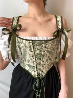 Reversible Botanical Floral overbust corset, green front lacing corset, Renaissance stays, Cosplay costume, Cottagecore corset bodice  ♡ This is a dream! Floral linen and a unique print. You will definitely fall in love with it at first sight and will receive endless compliments! Make your look chic with this stunning corset ♡ Decorated with botanical linen, unique print and dark green cotton on the other side, this accessory offers style and Cottagecore notes in one chic design. With lacing at Fitted Corset For Cosplay Events And Costume Parties, Fitted Corset For Costume Party And Cosplay, Fitted Fairycore Corset Dress For Costume, Fairycore Fitted Corset Dress For Costume, Fantasy Underbust Corset Dress With Boned Bodice, Fantasy Style Underbust Corset Dress With Boned Bodice, Steampunk Overbust Corset For Cosplay Events, Fitted Sleeveless Corset For Costumes, Green Corset Dress With Boned Bodice