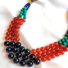 This stunning Multi-Gemstone Necklace features a unique blend of veined black jade, carnelian and other gemstones. Crafted with artistry and carefully selected natural stones, it's sure to become your favorite statement piece. Veined Black Jade (10mm) Carnelian (8mm) Turquoise (6mm) Lapis Lazuli (3mm) Freshwater Pearls (3mm) Goldfilled clasp and beads Brass details Length: 24" Elegant Multicolor Jewelry With Black Beads, Traditional Adjustable Onyx Jewelry, Black Agate Beaded Necklace With Gemstones, Black Onyx Beads Jewelry, Round Onyx Bead Jewelry, Spiritual Round Onyx Necklaces, Black Carnelian Jewelry For Gifts, Black Agate Round Bead Necklaces, Onyx Gemstone Beads Jewelry For Healing