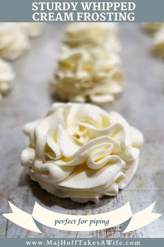 some white frosted cookies on a table with the words, how to make stuffed whipped cream frosting perfect for piping