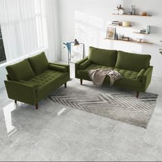 a living room with two green couches and a rug