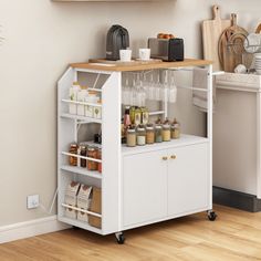 a kitchen cart with food and drinks on it in front of a wall mounted shelf