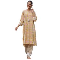 Our Afghani style chogha sets are as comfortable as they are beautiful! Designed to be free flowing and loose, this set is crafted in our signature block print cotton and comes with a top and salwar. Gorgeous tassel, lace, and shell details add interest and elevate this effortless look. This item is free size. One size fits most S-XXL. This item ships directly from Jaipur at no extra cost. Transitional Cotton Palazzo Set With Long Sleeves, Bohemian Palazzo Set With Printed Motifs For Transitional Seasons, Cotton Palazzo Set With Dabka, Transitional Cotton Salwar Kameez With Block Print, Transitional Season Cotton Salwar Kameez With Block Print, Navratri Straight Kurta Anarkali Set With Tassels, Navratri Anarkali Set With Tassels And Straight Kurta, Bohemian Lawn Suit With Chikankari Embroidery For Summer, Bollywood Style Cotton Pant Set For Spring