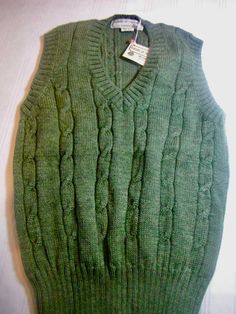 Vintage Tricots St. Raphael 100% pure wool, made in Uruguay, green, v-neck, never worn. Measurements Chest 36 Length 25 in. Classic Wool V-neck Sweater Vest, Classic Green Wool Sweater, Fitted Green Wool Sweater, Green V-neck Knitted Sweater, Classic Green Knitted Sweater, Casual Green Knitted V-neck Sweater, Classic Green V-neck Top, Green Wool Cable Knit Sweater, Classic Green Cable Knit Sweater