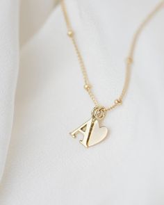 Personalized 14k solid gold initials necklace with beautiful beaded chain. Simple, minimalist everyday necklace.Perfect wearing alone or layering with your favorite necklaces. Each initial measures approx. 7mm You can add up to 5 Initials (Heart counts as ONE initial ) 16" or 18" Bead Chain 14k Gold * Leave us your initials and placement in the comment box at checkout. Tiny Diamond Necklace, Initials Necklace, Gold Initial Necklace, Jewelry Accessories Ideas, Initial Necklace Gold, Mom Jewelry, Everyday Necklace, Gold Initial, Initial Jewelry