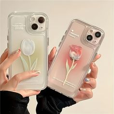 two women holding up their iphone cases with flowers on them