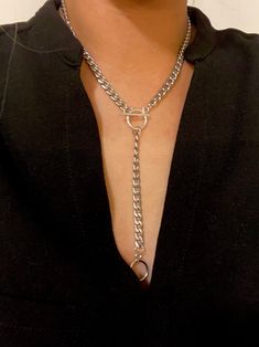 "Necklace comes in gold plated stainless steel or silver stainless steel. Necklace length around neck comes in 14.5\" - 17\" and drop is 4\". This solid and unique necklace is great alone or worn as a layering piece. Wear it as a necklace or as a lariat as shown in the photos! This necklace is a necklace that will dress up your outfit while giving you an edge. Great piece to add to your collection. Such a comfortable and amazing quality piece that you will reach for over and over! It is of great Silver Lariat Jewelry With Chunky Chain, Silver Lariat With Chunky Chain, Silver Lariat Stainless Steel Jewelry, Trendy Metal Lariat Jewelry, Trendy Silver Metal Lariat Necklace, Metal Lariat Jewelry With Chain Detail, Silver Lariat Toggle Necklace, Metal Lariat Chain Jewelry, Silver Lariat Necklace In Stainless Steel