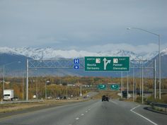 the highway sign is clearly visible for all of us to see on this stretch of road