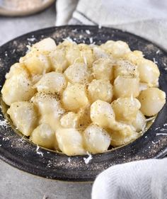 a black plate with some food on top of it